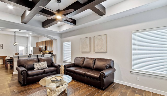 It features cozy furnishings, modern amenities, and a warm, homey atmosphere.