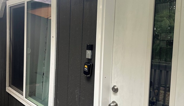 Julianna and Allan’s serene green belt view ADU with air conditioning unit.