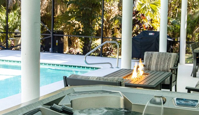 Jupiter. 2.5 serene and private acres. Surrounded by tropical landscaping.