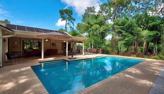Jupiter Farms Tropical Oasis with Lush Landscaping