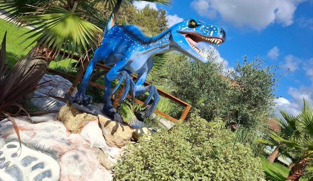 Jurassic cottage in a green setting with koi pond