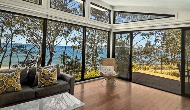 Karana Beach House - a serene coastal haven just a 2-minute walk from the beach.