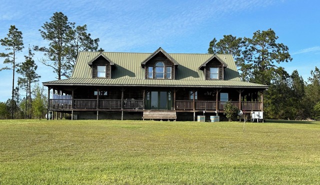 Kennedy Family Cabin- a large log cabin in a rural, farming community