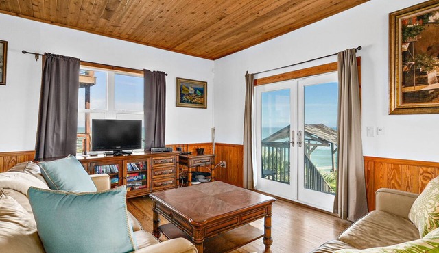 Key West-style oceanfront home with breathtaking views & beach access