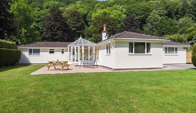Kick back and relax at this lovely riverside house in Montgomeryshire, Powys.