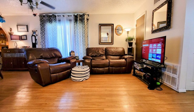 *King adjustable bed, massage chair, one level near KU, affordable luxury