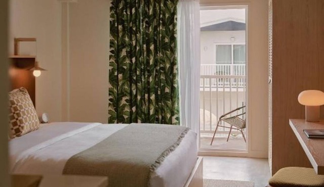King Room w/Balcony Overlooking Courtyard Pool + Rooftop Bar