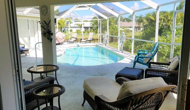 La dolce vita awaits in this immaculate pool home on fresh water canal.