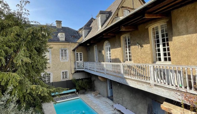 La Maison aux murs anciens et ses chambres