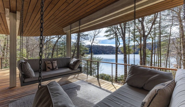 Lake access retreat on Lake Glenville with private dock with boat ties, kayaks, paddleboards, expansive deck, and fire pit seating. Sleeps 12 comfortably — designed for mountain air, lake days, and unforgettable nights under the stars.