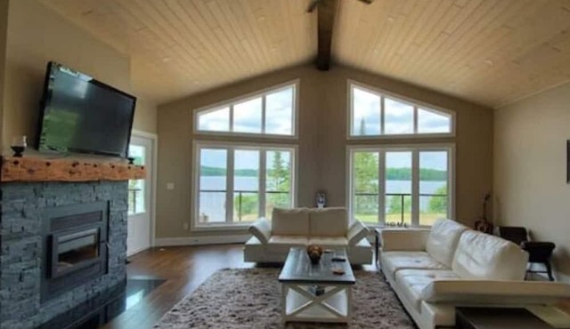 Lake Escape - Luxury Cottage With private man-made beach and shallow water entry