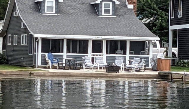 Lake front cottage recently remodeled w/private dock and optional pontoon boat.