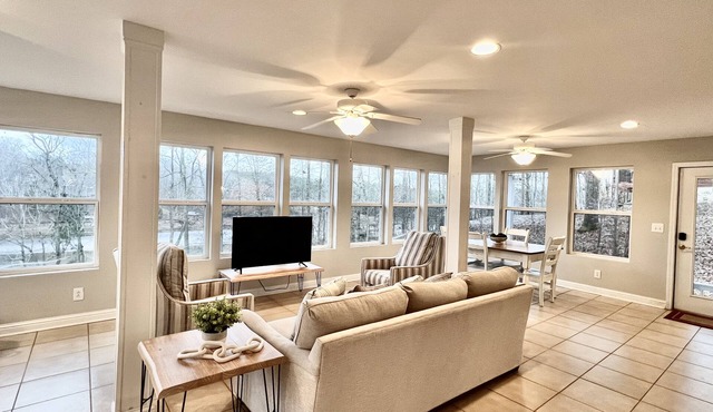 Lake front house near town and restaurants, paved road , year round water & dock