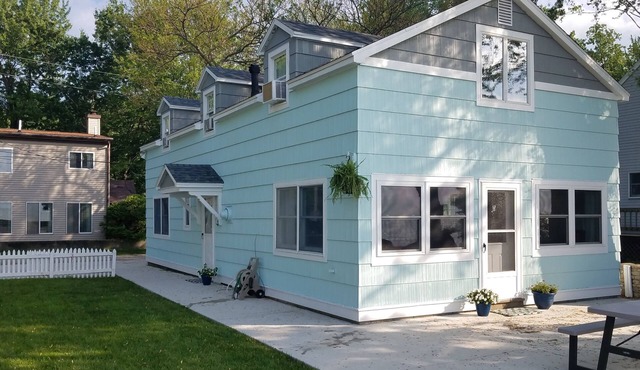 Lake Front Nautical Themed Home with Private Yard & Sandy Bottom Water Access!