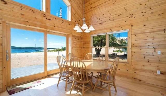 Lake frontage, Dune beach sand from deck to water! One of a kind.