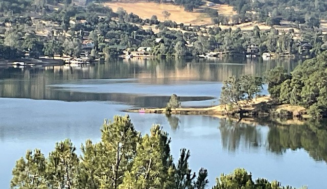 Lake house with fabulous views, game room, decking and hot tub.