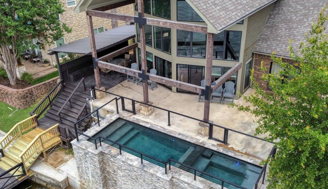 Lake House with pool + hot tub on Golf Course with boat dock