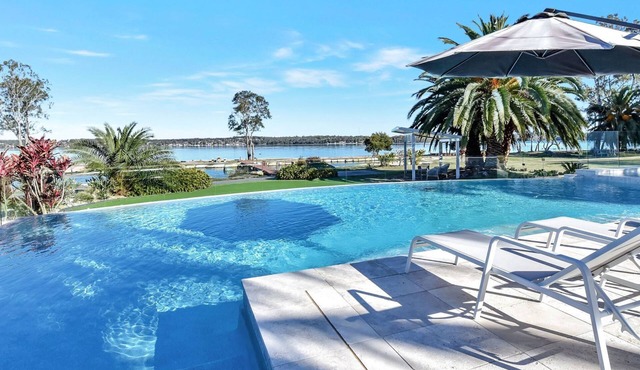 Lake Palm Resort Luxury Retreat absolute Waterfront on 3 acres at Lake Macquarie.
