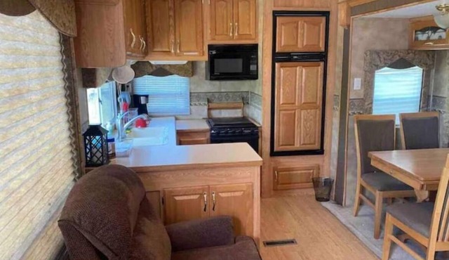 Lake shore queen bed trailer, tiki torches, & tent space for extra guest