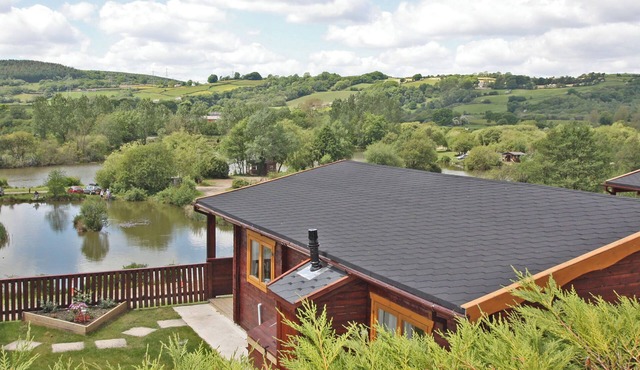 Lake side log cabin peacefully situated and each enjoying fabulous lake views.