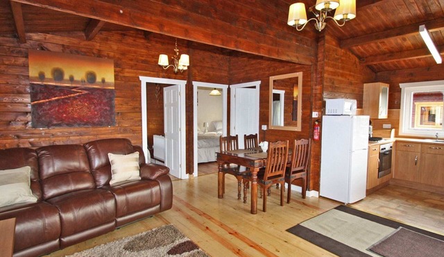 Lake side log cabin peacefully situated and each enjoying fabulous lake views.