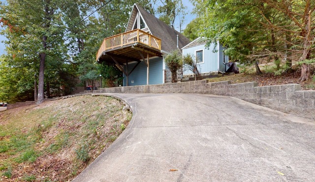 Lake-view condo with balcony, firepit, outdoor pool, 2 kayaks, & washer/dryer