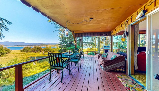 Lake-view dog-friendly home in great location with large deck, fireplace & grill