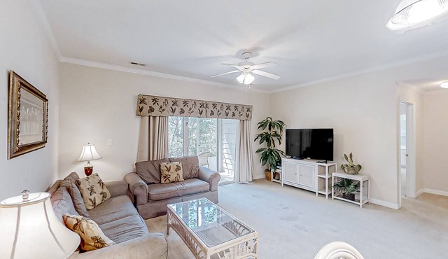 Lake-view ground-floor condo with screened patio, W/D, & pool