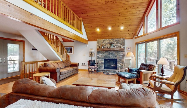 Lake-view home with hot tub, dock, decks, firepit, & AC - near slopes, dogs OK