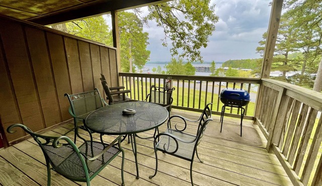 Lake view queen guest room with two queens, sleeper sofa and patio overlooking Lake Ouachita. by RedAwning