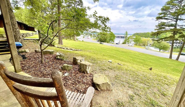 Lake view queen Guest Room with two queens, sleeper sofa and deck overlooking Lake Ouachita. by RedAwning