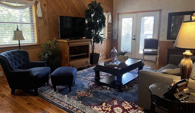 Lake view two bedroom, two bath loft, log-sided cottage with private hot tub overlooking Lake Ouachita. by RedAwning
