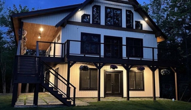 Lake Winnisquam. Large family lake view home with beach access. Sleeps 16.