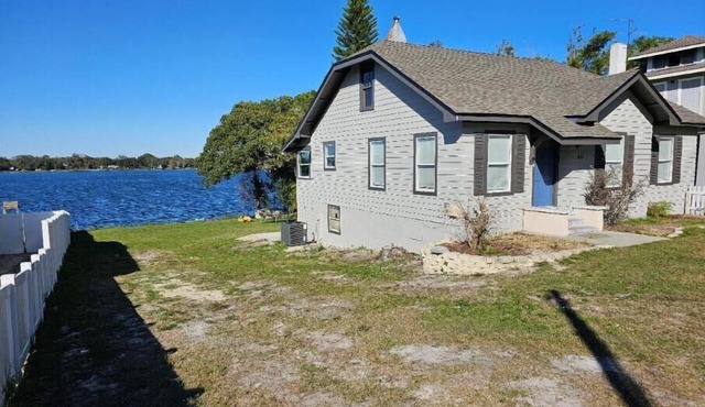 Lakefront 3 story 5/3 bungalo with huge yard, great views, a firepit and a dock.