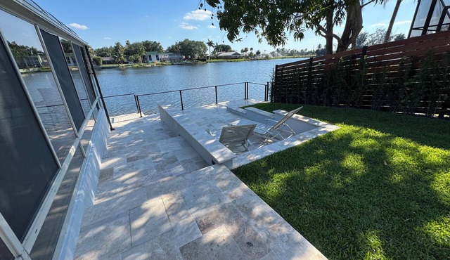 Lakefront 5-bedroom, 4 bathroom home in tranquil Miami Lakes with Fitness room.