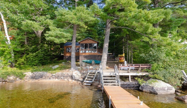 Lakefront cabin on Brandy Pond with dock, deck, firepit, kayaks & paddleboard