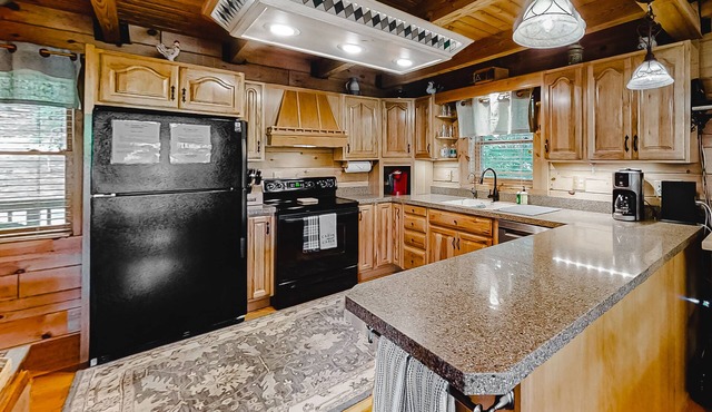 Lakefront cabin with private covered dock, lovely deck, lake view & fireplace