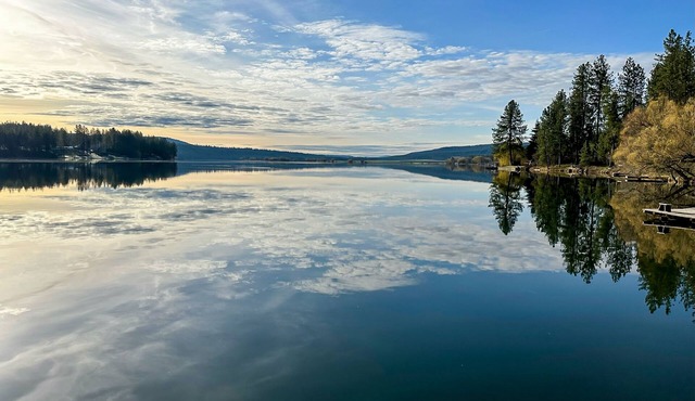 Lakefront chalet with dock, firepit, pizza oven, fireplace, & 2 primary suites