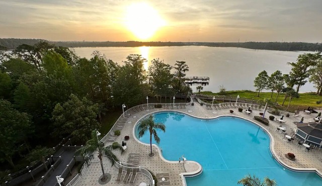 Lakefront condo with beautiful views, wifi, central AC, shared pool, & hot tub