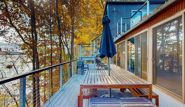 Lakefront contemporary gem with decks, lake views & pebble beach