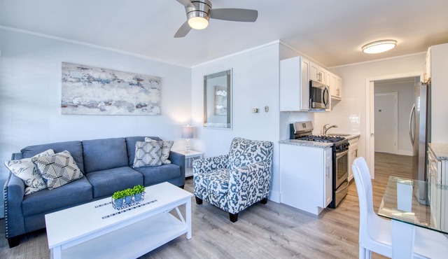 Lakefront corner condo with canoes, resort pool, tennis & firepit - dogs welcome