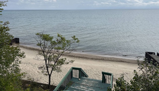 Lakefront cottage with 100ft private sandy beach.
