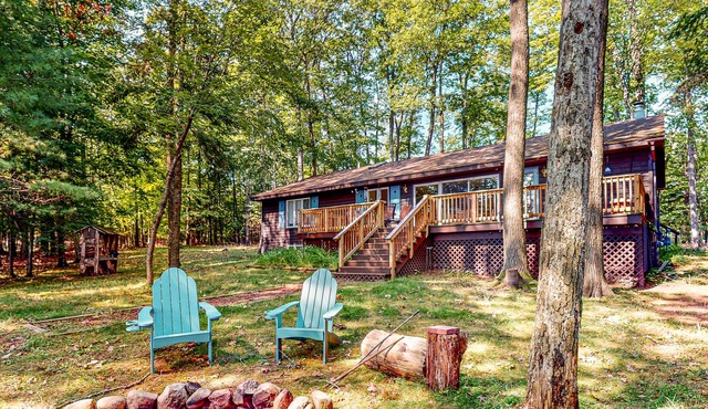 Lakefront, dog-friendly home with canoe, firepit, large deck, & washer/dryer