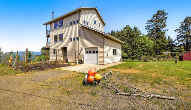 Lakefront escape with water views, grill, wrap-around deck - walk to beach