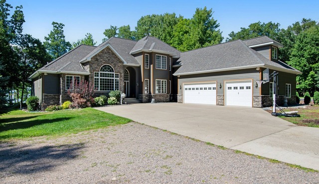 Lakefront estate with firepit, grill, game room & sauna - near Sand Valley Golf