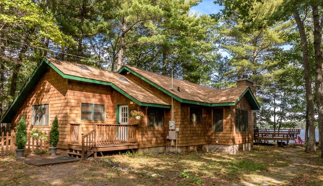 Lakefront home in a great location with docks, private beach, sauna & firepit