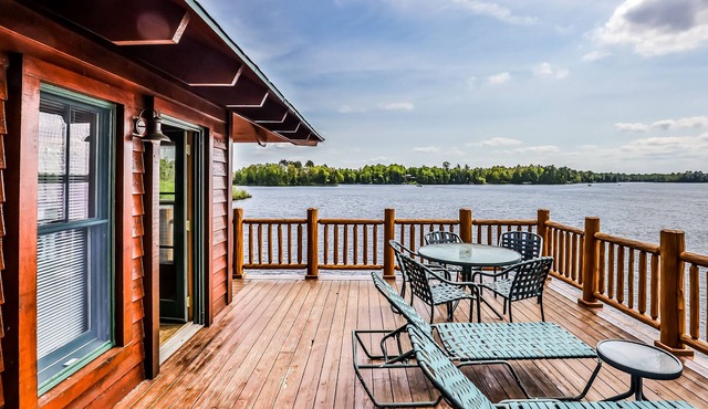 Lakefront home with large deck, gas grill, wood fireplace, heated pool, firepit