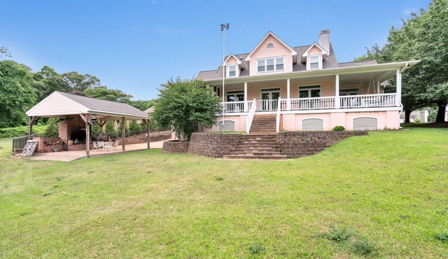 Lakefront home on a calm cove sitting on 4 acres!