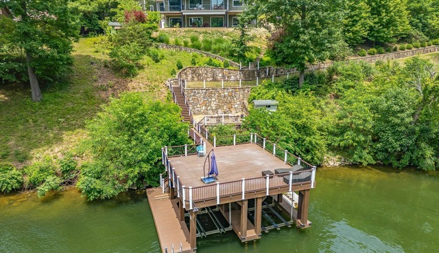 Lakefront home on Claytor Lake with private dock, scenic decks, stylish interiors, and cozy bedrooms