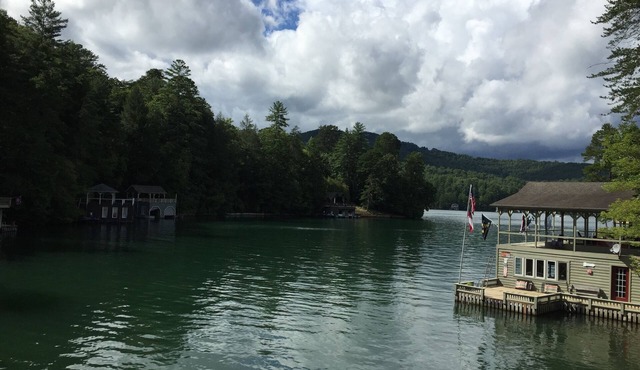 Lakefront home on Lake Rabun with huge boathouse and lots of patio space.